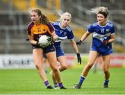 15 August 2021; Sadbh McCarthy of Wexford in action against Laura Nerney and Eva Galvin, right, of Laois during the TG4 All-Ireland Intermediate Ladies Football Championship Semi-Final match between Laois and Wexford at UPMC Nowlan Park in Kilkenny. Photo by Piaras Ó Mídheach/Sportsfile