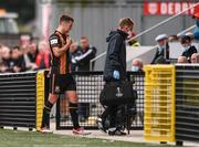 15 August 2021; Patrick McEleney of Dundalk leaves the pitch after picking up an injury with Dundalk physiotherapist Danny Miller, right, during the SSE Airtricity League Premier Division match between Derry City and Dundalk at Ryan McBride Brandywell Stadium in Derry. Photo by Ben McShane/Sportsfile