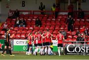 15 August 2021; Derry City players celebrate their first goal, scored by Jamie McGonigle, hidden, from a penalty during the SSE Airtricity League Premier Division match between Derry City and Dundalk at Ryan McBride Brandywell Stadium in Derry. Photo by Ben McShane/Sportsfile
