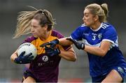 15 August 2021; Aisling Murphy of Wexford in action against Amy Potts of Laois during the TG4 All-Ireland Intermediate Ladies Football Championship Semi-Final match between Laois and Wexford at UPMC Nowlan Park in Kilkenny. Photo by Piaras Ó Mídheach/Sportsfile