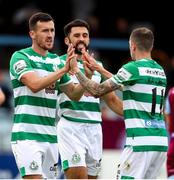 15 August 2021; Aaron Greene of Shamrock Rovers, left, celebrates after scoring his side's first goal with team-mate Roberto Lopes, centre, and Sean Kavanagh during the SSE Airtricity League Premier Division match between Drogheda United and Shamrock Rovers at Head in the Game Park in Drogheda, Louth. Photo by Michael P Ryan/Sportsfile