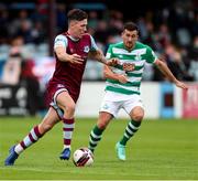 15 August 2021; Joe Redmond of Drogheda United in action against Aaron Greene of Shamrock Rovers during the SSE Airtricity League Premier Division match between Drogheda United and Shamrock Rovers at Head in the Game Park in Drogheda, Louth. Photo by Michael P Ryan/Sportsfile