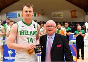 15 August 2021; John Carroll of Ireland is presented with his All Star award by FIBA Commissioner Robert Bald during the FIBA Men’s European Championship for Small Countries day five match between Ireland and Malta at National Basketball Arena in Tallaght, Dublin. Photo by Eóin Noonan/Sportsfile