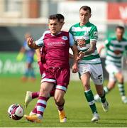 15 August 2021; Ronan Murray of Drogheda United in action against Sean Kavanagh of Shamrock Rovers during the SSE Airtricity League Premier Division match between Drogheda United and Shamrock Rovers at Head in the Game Park in Drogheda, Louth. Photo by Michael P Ryan/Sportsfile