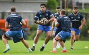 19 August 2021; Michael Alaalatoa is tackled by Caelan Doris, left, and Scott Penny during Leinster Rugby squad training at UCD in Dublin. Photo by Brendan Moran/Sportsfile