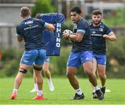 19 August 2021; Michael Alaalatoa is tackled by Scott Penny during Leinster Rugby squad training at UCD in Dublin. Photo by Brendan Moran/Sportsfile