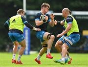 19 August 2021; Ryan Baird is tackled by Seán Cronin, left, and Devin Toner during Leinster Rugby squad training at UCD in Dublin. Photo by Brendan Moran/Sportsfile