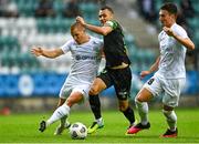 19 August 2021; Graham Burke of Shamrock Rovers in action against Henrik Ojamaa, left, and Markus Soomets of Flora Tallinn during the UEFA Europa Conference League play-off first leg match between Flora Tallinn and Shamrock Rovers at A. Le Coq Arena in Tallinn, Estonia Photo by Eóin Noonan/Sportsfile
