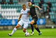 19 August 2021; Graham Burke of Shamrock Rovers in action against Henrik Ojamaa of Flora Tallinn during the UEFA Europa Conference League play-off first leg match between Flora Tallinn and Shamrock Rovers at A. Le Coq Arena in Tallinn, Estonia Photo by Eóin Noonan/Sportsfile