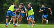 19 August 2021; Conor O'Brien is tackled by Ross Molony, left, and Ed Byrne during Leinster Rugby squad training at UCD in Dublin. Photo by Brendan Moran/Sportsfile