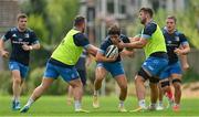 19 August 2021; Jimmy O'Brien is tackled by Ed Byrne, left, and Caelan Doris during Leinster Rugby squad training at UCD in Dublin. Photo by Brendan Moran/Sportsfile