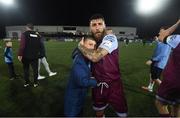 20 August 2021; Gary Deegan of Drogheda United hugs Alex Conroy, son of the late Drogheda United coach David Conroy, who passed away on Thursday following a tragic accident, after the SSE Airtricity League Premier Division match between Dundalk and Drogheda United at Oriel Park in Dundalk, Louth. Photo by Stephen McCarthy/Sportsfile