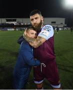 20 August 2021; Gary Deegan of Drogheda United hugs Alex Conroy, son of the late Drogheda United coach David Conroy, who passed away on Thursday following a tragic accident, after the SSE Airtricity League Premier Division match between Dundalk and Drogheda United at Oriel Park in Dundalk, Louth. Photo by Stephen McCarthy/Sportsfile