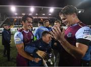 20 August 2021; James Brown, left, and Daniel O'Reilly of Drogheda United with Alex Conroy, son of the late Drogheda United coach David Conroy, who passed away on Thursday following a tragic accident, after the SSE Airtricity League Premier Division match between Dundalk and Drogheda United at Oriel Park in Dundalk, Louth. Photo by Stephen McCarthy/Sportsfile Photo by Stephen McCarthy/Sportsfile