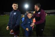 20 August 2021; Alex Conroy, son of the late Drogheda United coach David Conroy, who passed away on Thursday following a tragic accident, with Drogheda United assistant manager Kevin Doherty, right, and Jake Hyland after the SSE Airtricity League Premier Division match between Dundalk and Drogheda United at Oriel Park in Dundalk, Louth. Photo by Stephen McCarthy/Sportsfile