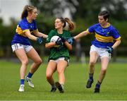 21 August 2021; Iris Kennelly of Limerick in action against Laurie Ahern, left, and Aoife Gillen of Wicklow during the TG4 All-Ireland Ladies Football Junior Championship Semi-Final match between Wicklow and Limerick at Joe Foxe Memorial Park, Tang GAA Club in Westmeath. Photo by Ray McManus/Sportsfile