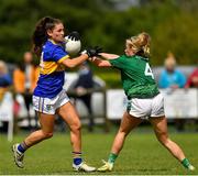 21 August 2021; Catherine Dempsey of Wicklow in action against Charlotte Walsh of Limerick during the TG4 All-Ireland Ladies Football Junior Championship Semi-Final match between Wicklow and Limerick at Joe Foxe Memorial Park, Tang GAA Club in Westmeath. Photo by Ray McManus/Sportsfile