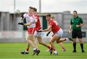 21 August 2021; Ronan Fox of Tyrone in action against Colm Gillespie and Hugh O'Connor of Cork during the 2021 Electric Ireland GAA Football All-Ireland Minor Championship Semi-Final match between Cork and Tyrone at Bord Na Mona O'Connor Park in Tullamore, Offaly. Photo by Matt Browne/Sportsfile