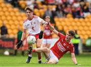 21 August 2021; Colm Gillespie of Cork in action against Hugh Cunningham of Tyrone during the 2021 Electric Ireland GAA Football All-Ireland Minor Championship Semi-Final match between Cork and Tyrone at Bord Na Mona O'Connor Park in Tullamore, Offaly. Photo by Matt Browne/Sportsfile
