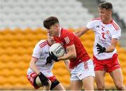 21 August 2021; Luke O'Herlihy of Cork in action against Matthew Mallon and Shea O'Hare of Tyrone during the 2021 Electric Ireland GAA Football All-Ireland Minor Championship Semi-Final match between Cork and Tyrone at Bord Na Mona O'Connor Park in Tullamore, Offaly. Photo by Matt Browne/Sportsfile