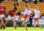 21 August 2021; Ronan Strain of Tyrone in action against Alan Kelleher of Cork during the 2021 Electric Ireland GAA Football All-Ireland Minor Championship Semi-Final match between Cork and Tyrone at Bord Na Mona O'Connor Park in Tullamore, Offaly. Photo by Matt Browne/Sportsfile