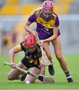 21 August 2021; Orla Sinnott of Wexford and Grace Walsh of Kilkenny contest possession during the All-Ireland Senior Camogie Championship quarter-final match between Kilkenny and Wexford at Páirc Uí Chaoimh in Cork. Photo by Piaras Ó Mídheach/Sportsfile
