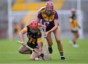21 August 2021; Orla Sinnott of Wexford and Grace Walsh of Kilkenny contest possession during the All-Ireland Senior Camogie Championship quarter-final match between Kilkenny and Wexford at Páirc Uí Chaoimh in Cork. Photo by Piaras Ó Mídheach/Sportsfile