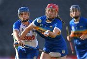 21 August 2021; Aoife McGrath of Tipperary in action against Vikki Falconer of Waterford during the All-Ireland Senior Camogie Championship Quarter-Final match between Tipperary and Waterford at Páirc Uí Chaoimh in Cork. Photo by Piaras Ó Mídheach/Sportsfile