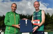 21 August 2021; Stephen Connon of Brothers Pearse AC, Dublin, representing Ireland, is presented with his medal by John O'Regan, after finishing second in the men's 100 kilometre race, at the Irish National 50 kilometre and 100 kilometre Championships, incorporating the Anglo Celtic Plate, at Mondello Park in Naas, Kildare. Photo by Brendan Moran/Sportsfile