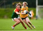 22 August 2021; Theresa Mellon of Antrim in action against Caoimhe O'Neill of Carlow during the TG4 All-Ireland Ladies Football Junior Championship Semi-Final match between Antrim and Carlow at Lannleire GFC in Dunleer, Louth. Photo by Ben McShane/Sportsfile