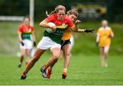 22 August 2021; Cliodhna Ni Shé of Carlow in action against Duana Coleman of Antrim during the TG4 All-Ireland Ladies Football Junior Championship Semi-Final match between Antrim and Carlow at Lannleire GFC in Dunleer, Louth. Photo by Ben McShane/Sportsfile
