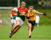 22 August 2021; Cliodhna Ni Shé of Carlow in action against Duana Coleman of Antrim during the TG4 All-Ireland Ladies Football Junior Championship Semi-Final match between Antrim and Carlow at Lannleire GFC in Dunleer, Louth. Photo by Ben McShane/Sportsfile