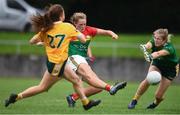 22 August 2021; Cliodhna Ni Shé of Carlow shoots to score her side's third goal past Antrim goalkeeper Anna McCann during the TG4 All-Ireland Ladies Football Junior Championship Semi-Final match between Antrim and Carlow at Lannleire GFC in Dunleer, Louth. Photo by Ben McShane/Sportsfile