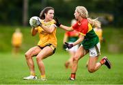 22 August 2021; Maria O'Neill of Antrim in action against Niamh Murphy of Carlow during the TG4 All-Ireland Ladies Football Junior Championship Semi-Final match between Antrim and Carlow at Lannleire GFC in Dunleer, Louth. Photo by Ben McShane/Sportsfile