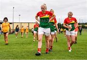 22 August 2021; Carlow players, including Elaine Ware, make their way off the pitch after their defeat in the TG4 All-Ireland Ladies Football Junior Championship Semi-Final match between Antrim and Carlow at Lannleire GFC in Dunleer, Louth. Photo by Ben McShane/Sportsfile