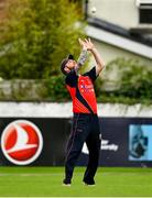 22 August 2021; Ryan Barr of Brigade catches Cork Harlequins' Murtaza Sidiqi in the outfield during the Clear Currency All-Ireland T20 Cup Final match between Cork Harlequins and Brigade at Leinster Cricket Club in Dublin. Photo by Seb Daly/Sportsfile
