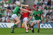 22 August 2021; Damien Cahalane of Cork is held up by Cian Lynch, left, and Darragh O’Donovan of Limerick during the GAA Hurling All-Ireland Senior Championship Final match between Cork and Limerick in Croke Park, Dublin. Photo by Brendan Moran/Sportsfile