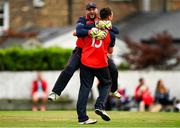 22 August 2021; Simon Olphert, left, and Ryan MacBeth of Brigade celebrate their side's victory over Cork Harlequins in their Clear Currency All-Ireland T20 Cup Final match at Leinster Cricket Club in Dublin. Photo by Seb Daly/Sportsfile