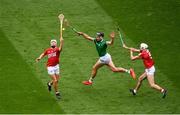 22 August 2021; Gearóid Hegarty of Limerick in action against Luke Meade, left, and Tim O’Mahony of Cork during the GAA Hurling All-Ireland Senior Championship Final match between Cork and Limerick in Croke Park, Dublin. Photo by Daire Brennan/Sportsfile