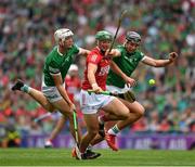 22 August 2021; Robbie O’Flynn of Cork is tackled by Kyle Hayes, left, and Gearóid Hegarty of Limerick during the GAA Hurling All-Ireland Senior Championship Final match between Cork and Limerick in Croke Park, Dublin. Photo by Ray McManus/Sportsfile