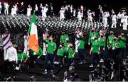 24 August 2021; Ireland flagbearers Jordan Lee, right, and Britney Arendse carry the Irish tri-colour during the Opening Ceremony of the Tokyo 2020 Paralympic Games at the Olympic Stadium in Tokyo, Japan. Photo by Sam Barnes/Sportsfile