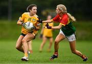 22 August 2021; Maria O'Neill of Antrim and Niamh Murphy of Carlow during the TG4 All-Ireland Ladies Football Junior Championship Semi-Final match between Antrim and Carlow at Lannleire GFC in Dunleer, Louth. Photo by Ben McShane/Sportsfile