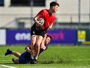 25 August 2021; Dan Holmes of North-East is tackled by Luke Ingle of Metropolitan during the Shane Horgan Cup Round 2 match between Metro and North East at Energia Park in Dublin.  Photo by Eóin Noonan/Sportsfile