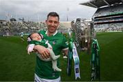 22 August 2021; Limerick's Graeme Mulcahy and daughter Róise celebrate with the Liam MacCarthy Cup following the GAA Hurling All-Ireland Senior Championship Final match between Cork and Limerick in Croke Park, Dublin. Photo by Stephen McCarthy/Sportsfile