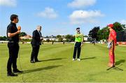 27 August 2021; Team captains Craig Ervine of Zimbabwe, right, Andrew Balbirnie of Ireland, match referee Kevin Gallagher and commentator Andrew Blair White of HBV Studios during the coin toss before match one of the Dafanews T20 series between Ireland and Zimbabwe at Clontarf Cricket Club in Dublin. Photo by Seb Daly/Sportsfile