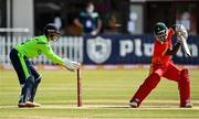 27 August 2021; Ireland wicketkeeper Neil Rock and Regis Chakabva of Zimbabwe during match one of the Dafanews T20 series between Ireland and Zimbabwe at Clontarf Cricket Club in Dublin. Photo by Seb Daly/Sportsfile