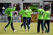 27 August 2021; Andrew Balbirnie of Ireland, second left, is congratulated by team-mates after catching Zimbabwe's Craig Ervine during match one of the Dafanews T20 series between Ireland and Zimbabwe at Clontarf Cricket Club in Dublin. Photo by Seb Daly/Sportsfile
