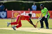 27 August 2021; Richard Ngarava of Zimbabwe attempts to field the ball during match one of the Dafanews T20 series between Ireland and Zimbabwe at Clontarf Cricket Club in Dublin. Photo by Seb Daly/Sportsfile