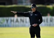 27 August 2021; Umpire Roland Black signals a boundary during match one of the Dafanews T20 series between Ireland and Zimbabwe at Clontarf Cricket Club in Dublin. Photo by Seb Daly/Sportsfile