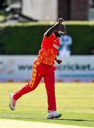 27 August 2021; Luke Jongwe of Zimbabwe celebrates taking the wicket of Ireland's Paul Stirling during match one of the Dafanews T20 series between Ireland and Zimbabwe at Clontarf Cricket Club in Dublin. Photo by Seb Daly/Sportsfile